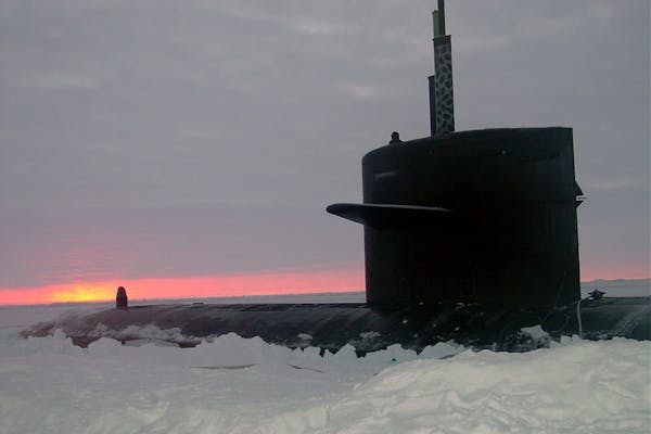 031000-N-XXXXB-004
Arctic Circle (Oct. 2003) -- The Los Angeles-class fast attack submarine USS Honolulu (SSN 718) sits surfaced 280 miles from the North Pole at sunset. Commanded by Cmdr. Charles Harris, USS Honolulu while conducting otherwise classified operations in the Arctic, collected scientific data and water samples for U.S. and Canadian Universities as part of an agreement with the Artic Submarine Laboratory (ASL) and the National Science Foundation (NSF).  USS Honolulu is the 24th Los Angeles-class submarine, and the first original design in her class to visit the North Pole region.  Honolulu is as assigned to Commander Submarine Pacific, Submarine Squadron Three, Pearl Harbor, Hawaii.  U. S. Navy photo by Chief Yeoman Alphonso Braggs.  (RELEASED)
